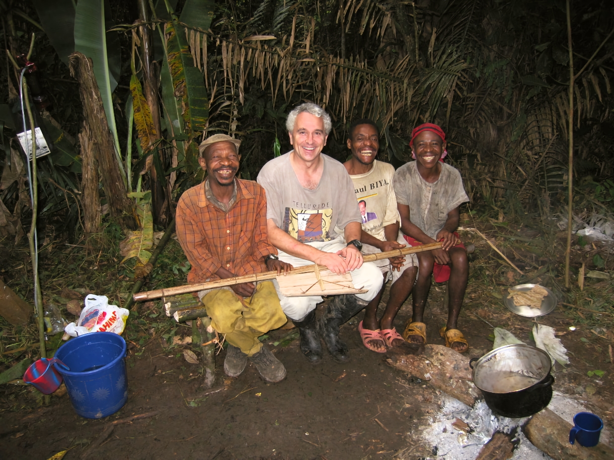 Tom Smith poses with Baka guides, who have helped him get around in Central Africa.